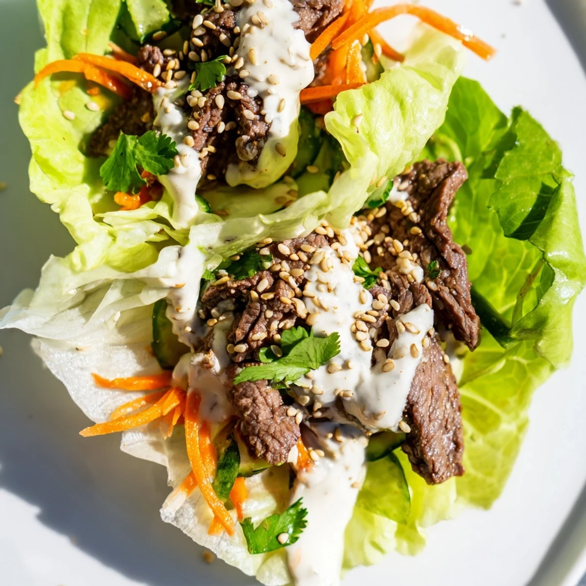 Succulent marinated beef, crisp lettuce, and julienned vegetables are neatly rolled into a fresh Beef Wrap with Lettuce.