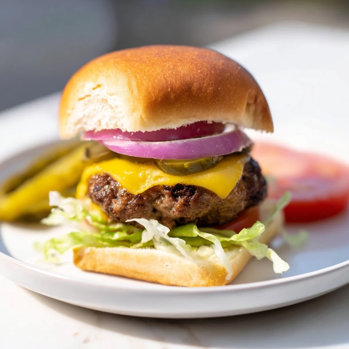 Juicy mini beef burgers with melted cheddar, served on toasted slider buns, ideal for family dinners or parties.