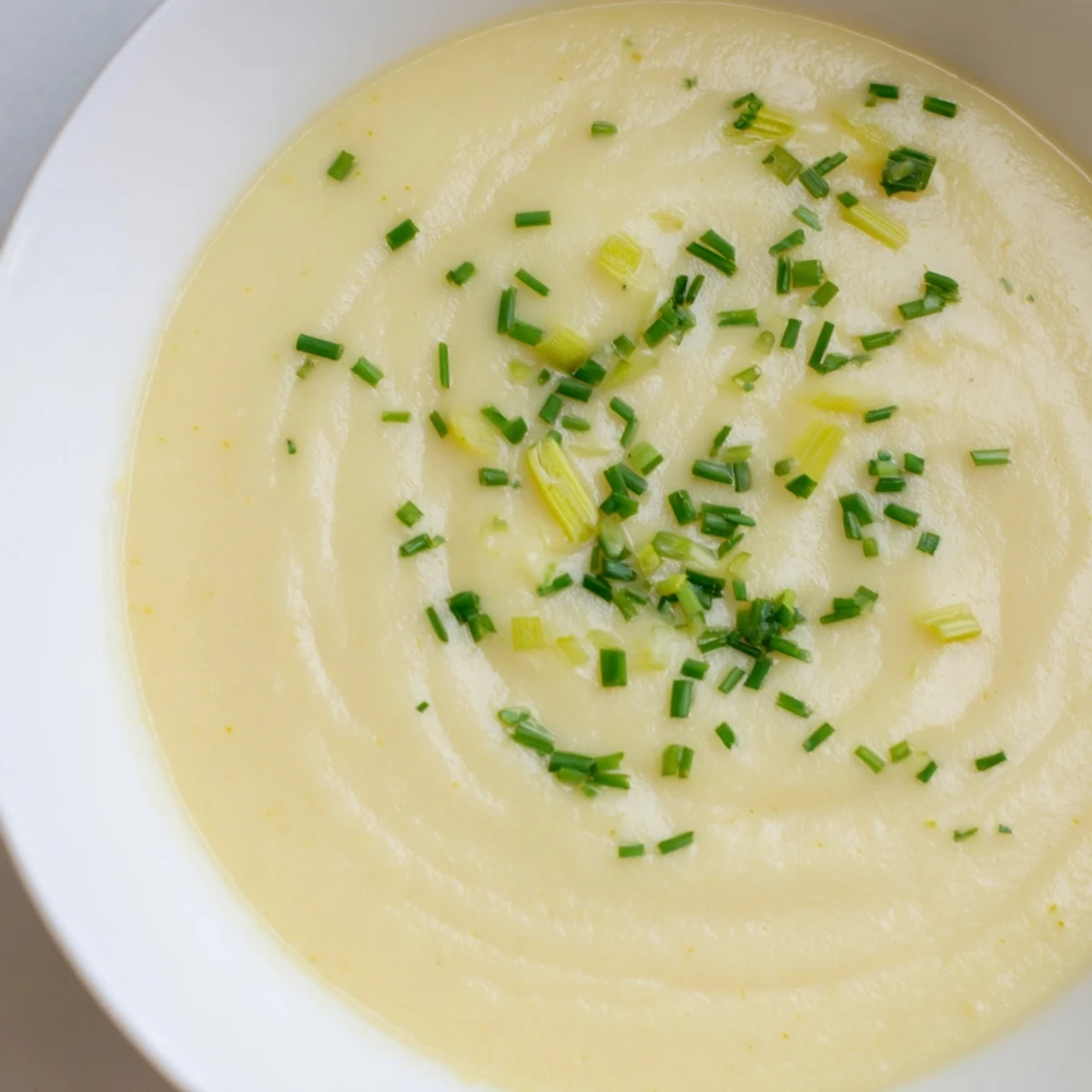 Creamy Potato and Leek Soup blends Yukon Gold potatoes with sautéed leeks and cream.