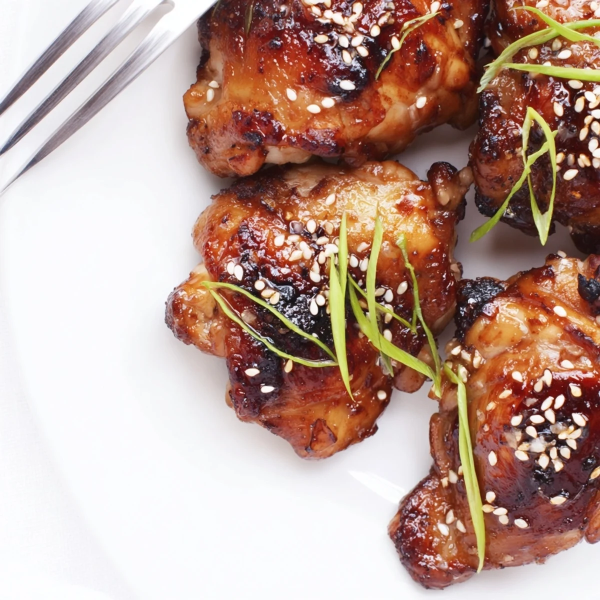 Tender roasted garlic miso chicken served over steamed white rice with fresh scallions