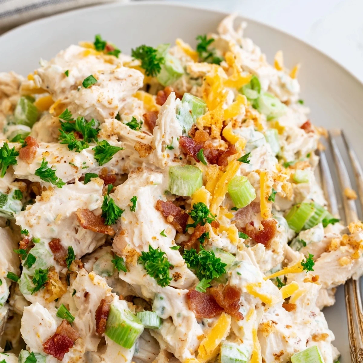 Chunky low carb jalapeno popper cottage cheese chicken salad served on crisp lettuce leaves