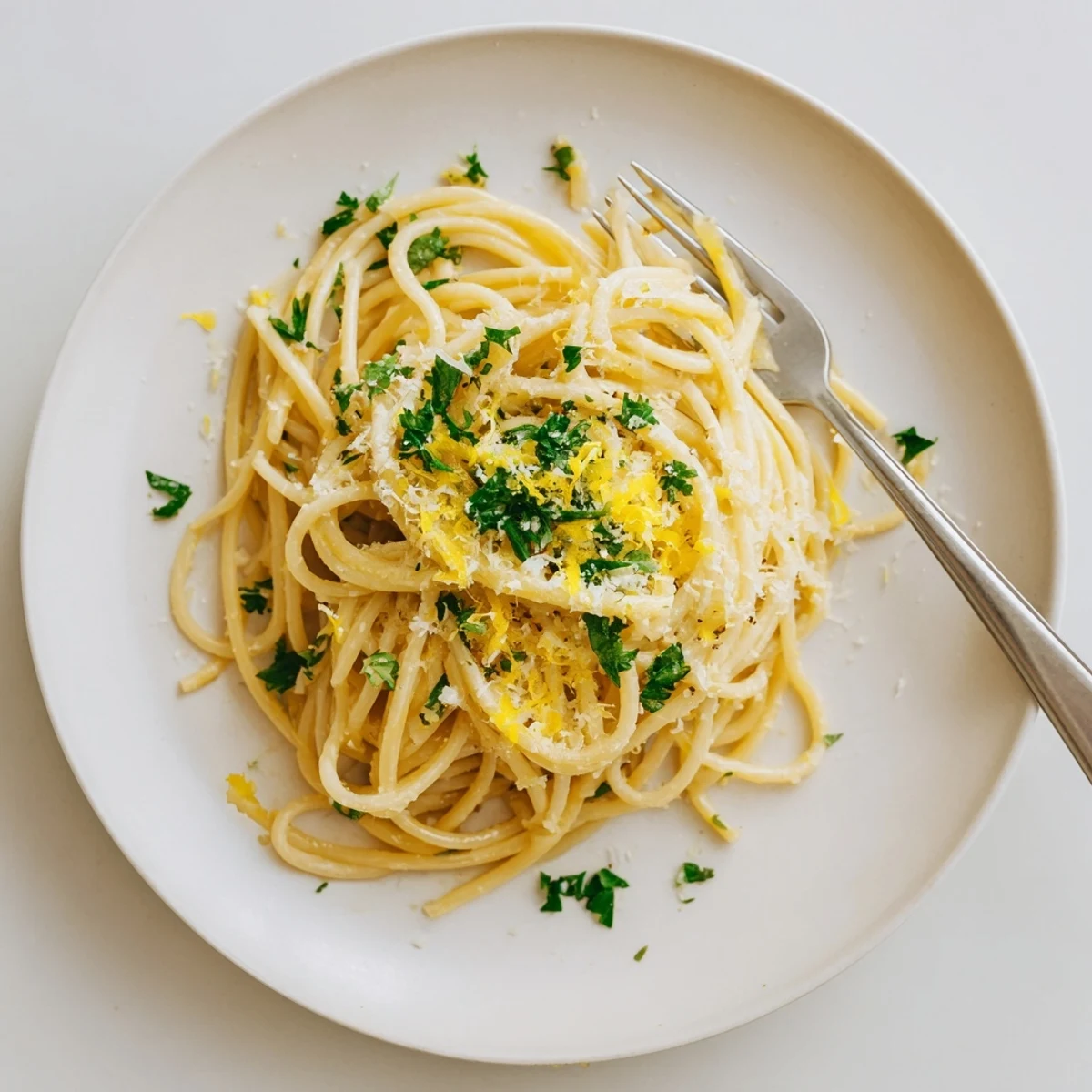 Creamy one pot garlic butter pasta tossed with parmesan and fresh parsley in a rustic bowl