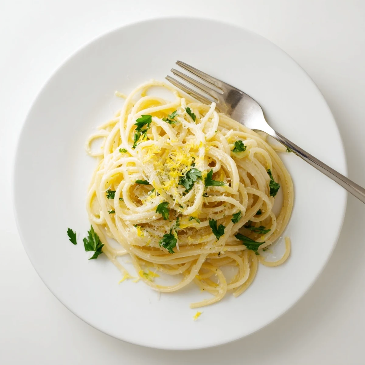 Savory one pot garlic butter pasta steaming hot with grated parmesan and vibrant green parsley garnish