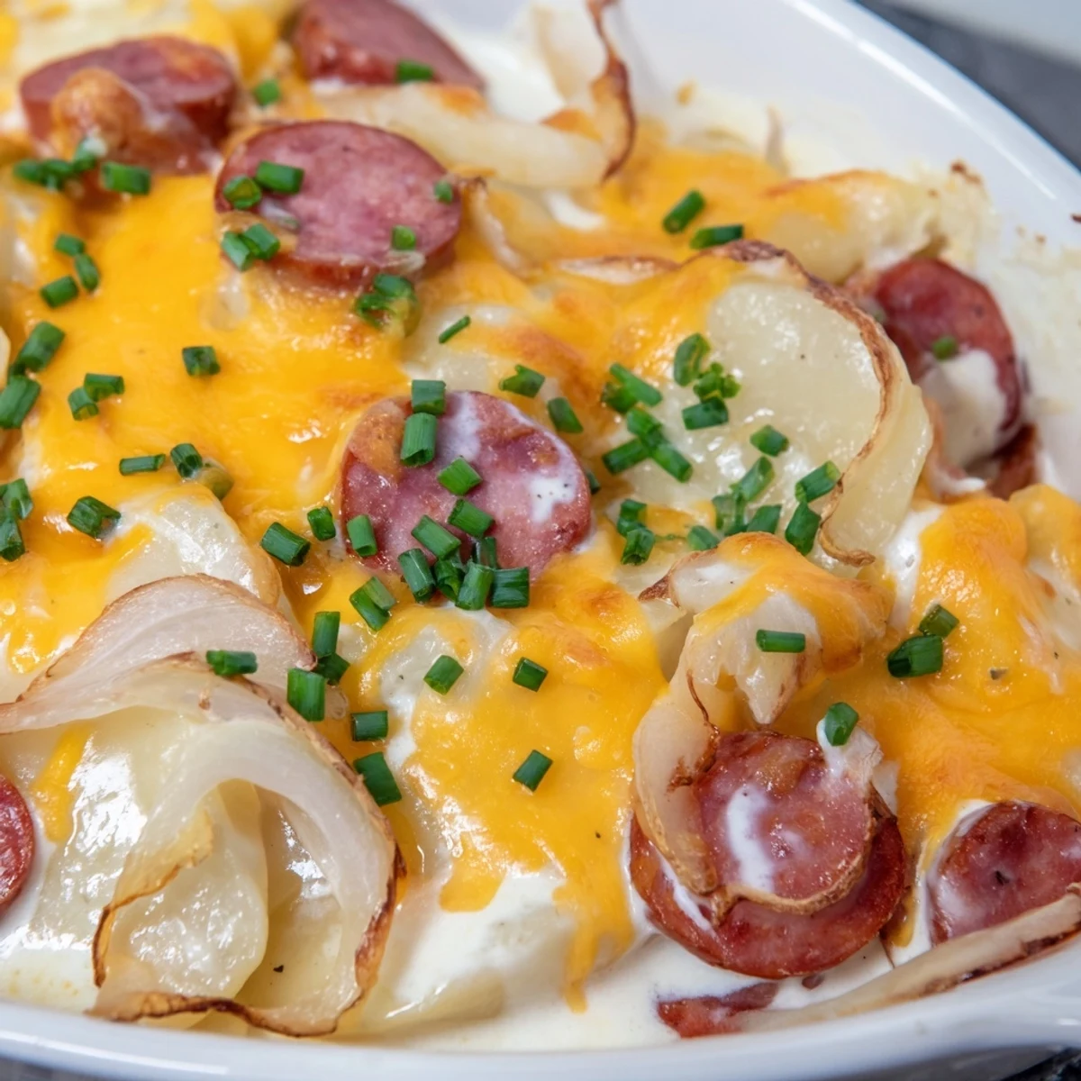 Golden melted cheddar cheese tops this slow cooker Crock Pot Pierogi Casserole with Kielbasa