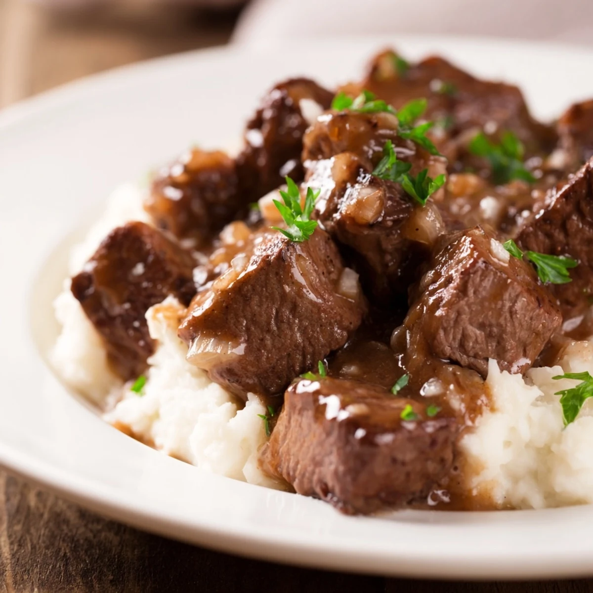 Fork-tender beef cubes in brown gravy slow-cooked to perfection, plated with fluffy white rice