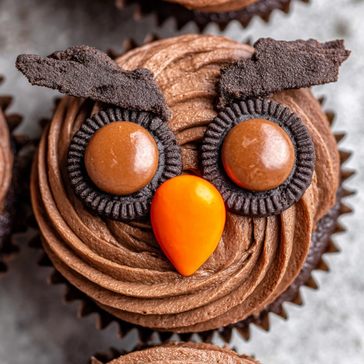 Rich chocolate Oreo Owl Cupcakes with creamy frosting and playful cookie owl faces on display