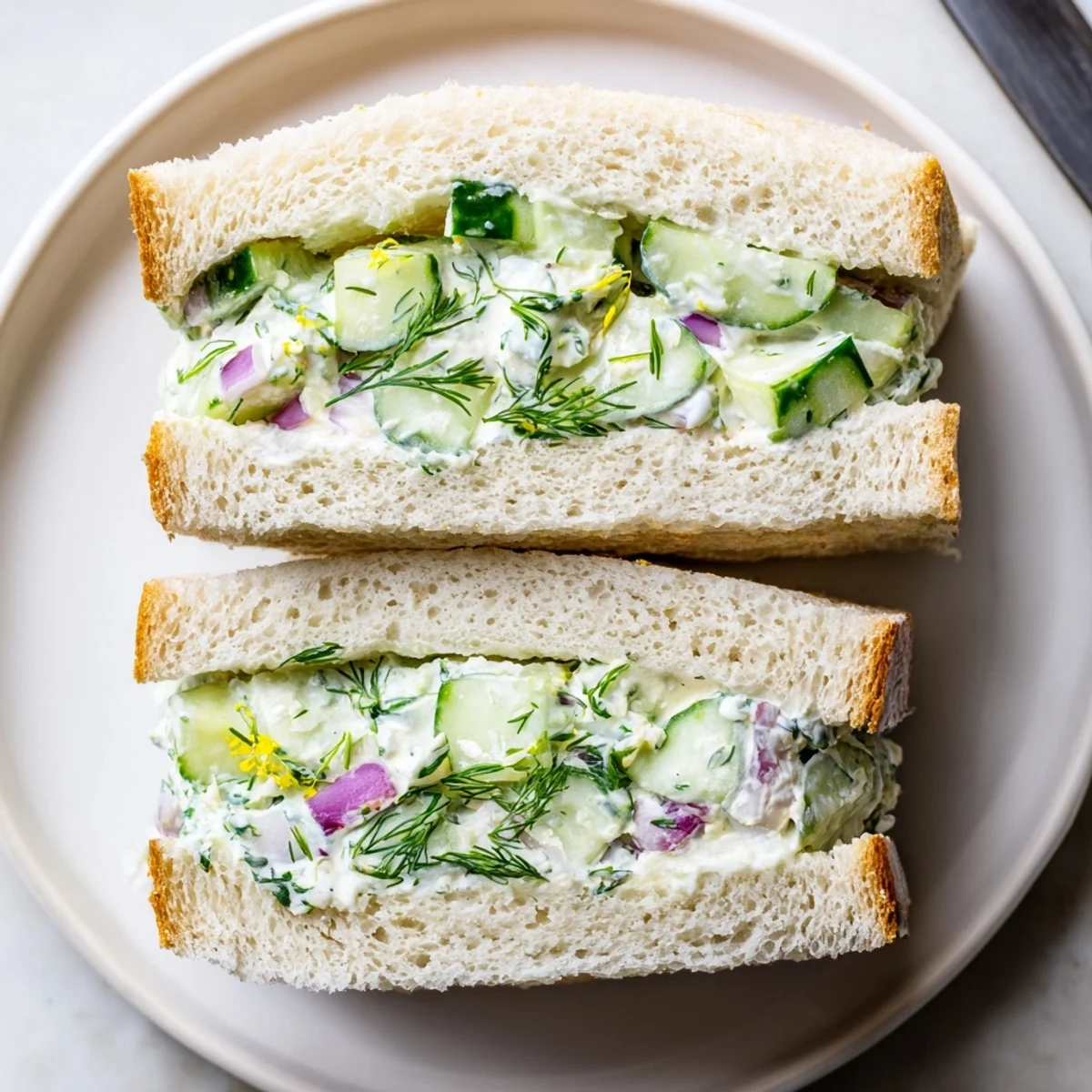 Stack of Quick Cucumber Salad Sandwiches, dill-scented filling, perfect picnic snack