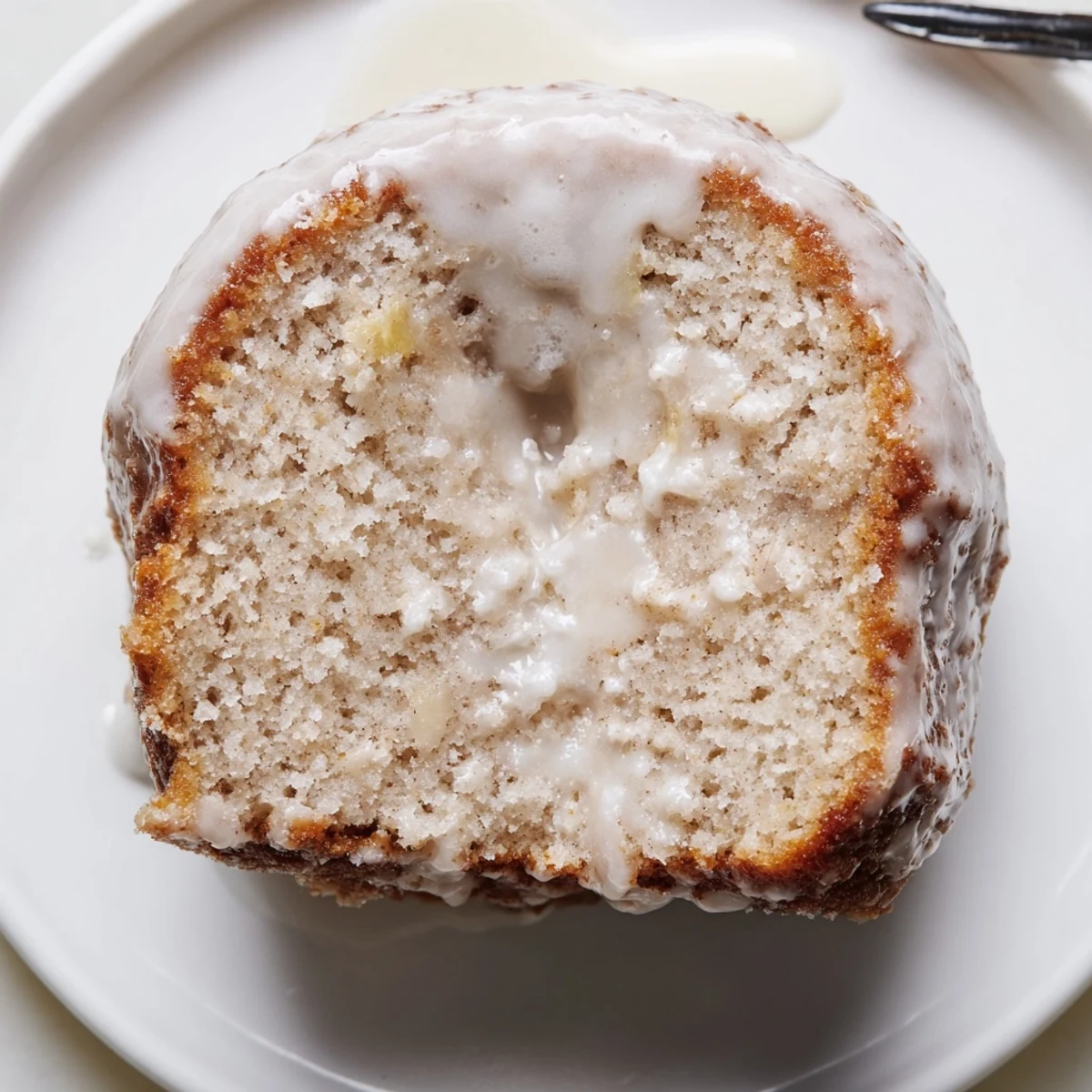 Glazed Banana Donuts stacked on a plate, soft crumb, vanilla-sweet scent.