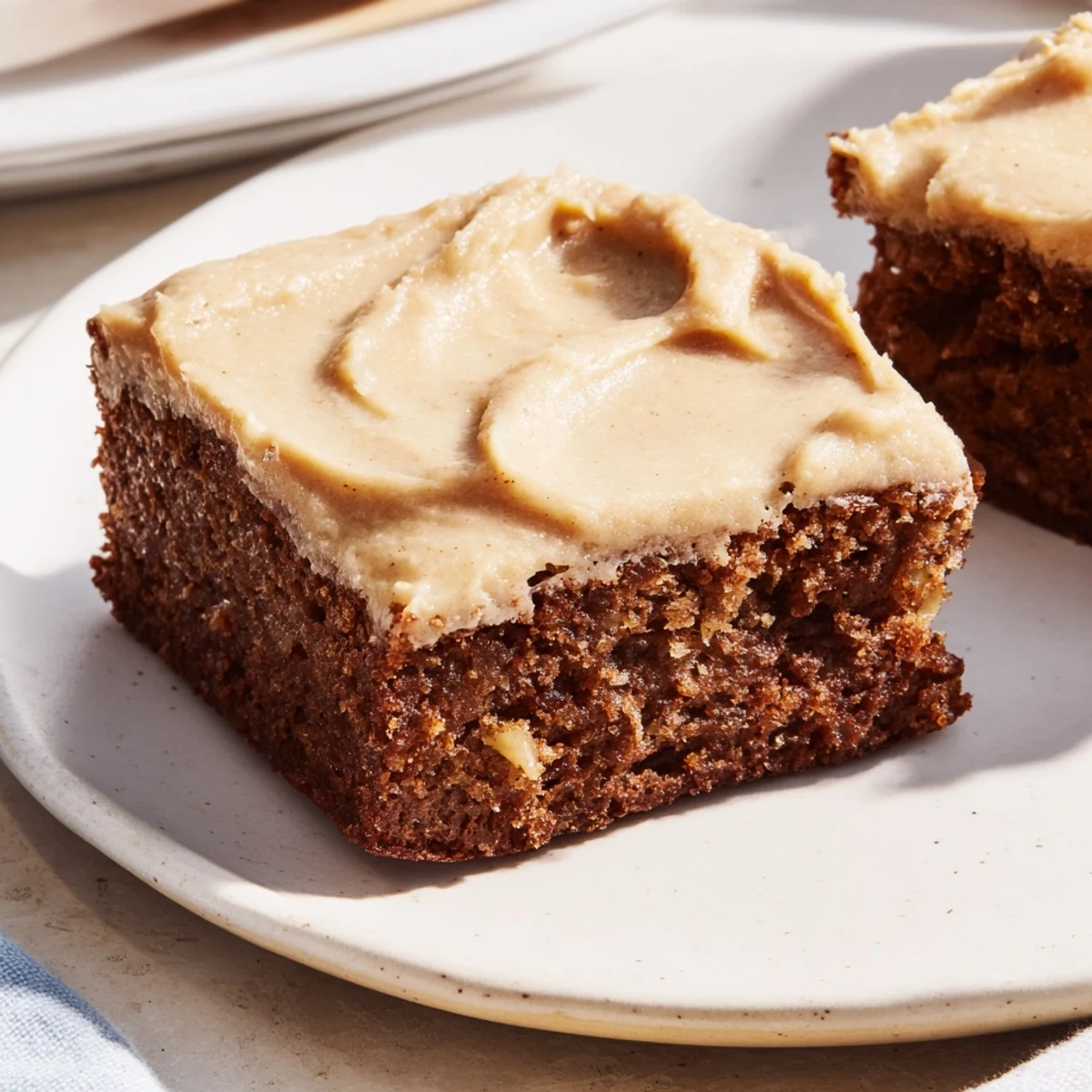 Moist banana bread brownie squares drizzled with rich brown butter glaze
