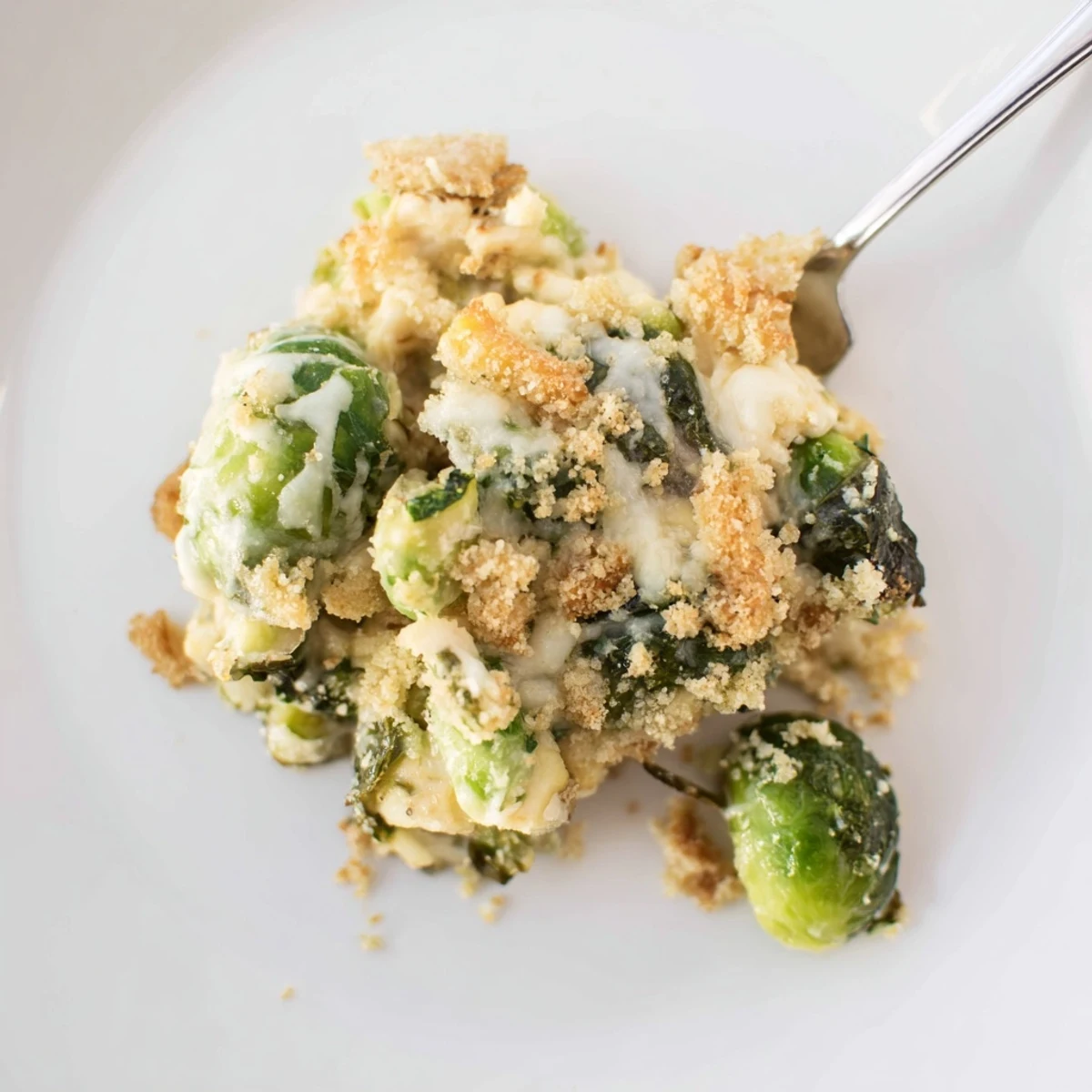 Creamy Parmesan Brussels Sprouts Casserole bubbling with golden breadcrumb topping, savory aroma