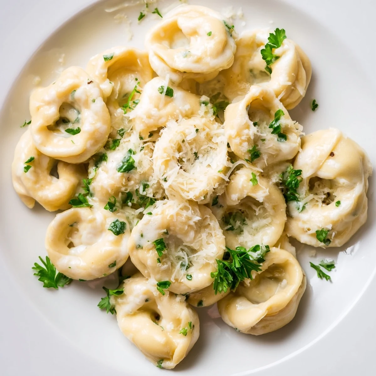 Delicate pasta parcels filled with savory chicken and ricotta served in a light cream sauce.